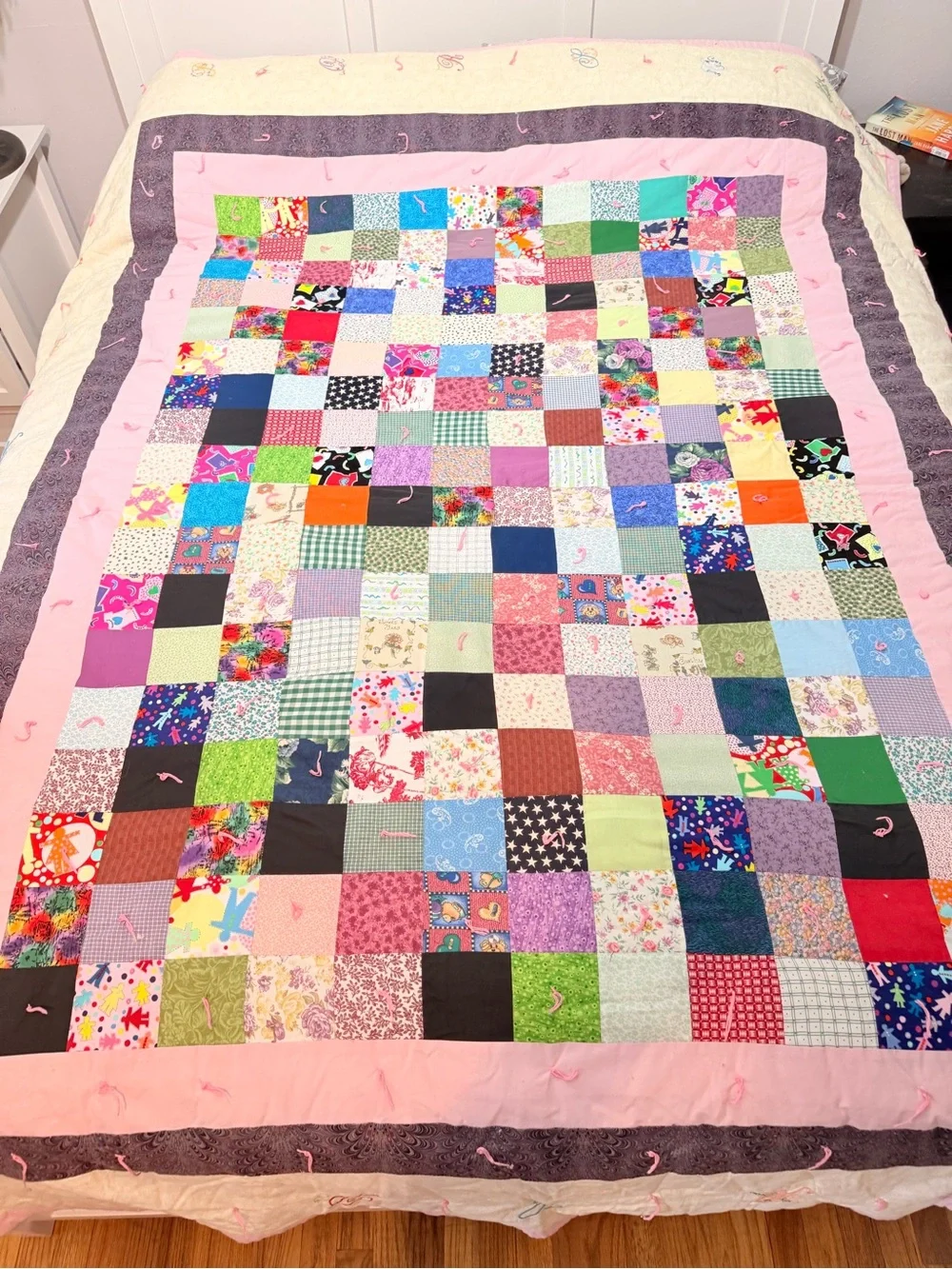 Hand crafted patchwork quilt with tan border